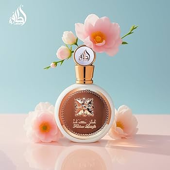 Perfume bottle with flowers on a light blue background