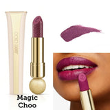 Luxury Jimmy Choo Seduction Collection Lipstick in shade 009 Magic Choo. The gold-tone faceted case is open, showing a deep berry-plum lipstick bullet with a signature python-skin embossed pattern.