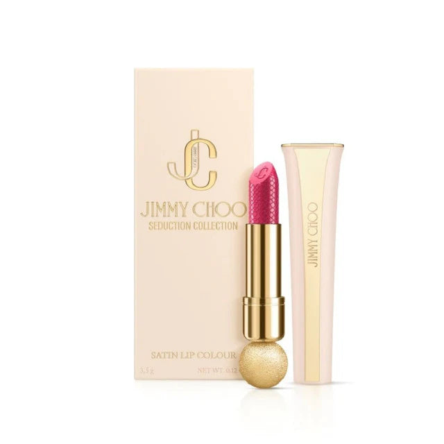 Luxury Jimmy Choo Seduction Collection Lipstick in shade 007 Hot Pink. Features a vibrant fuchsia-pink bullet with python-skin embossing, housed in a heavy, faceted gold-tone designer case.
